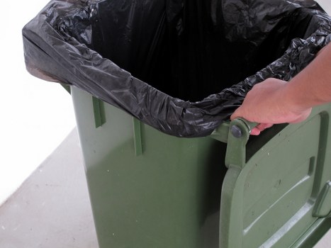 Waste collection trucks operating in busy Central London